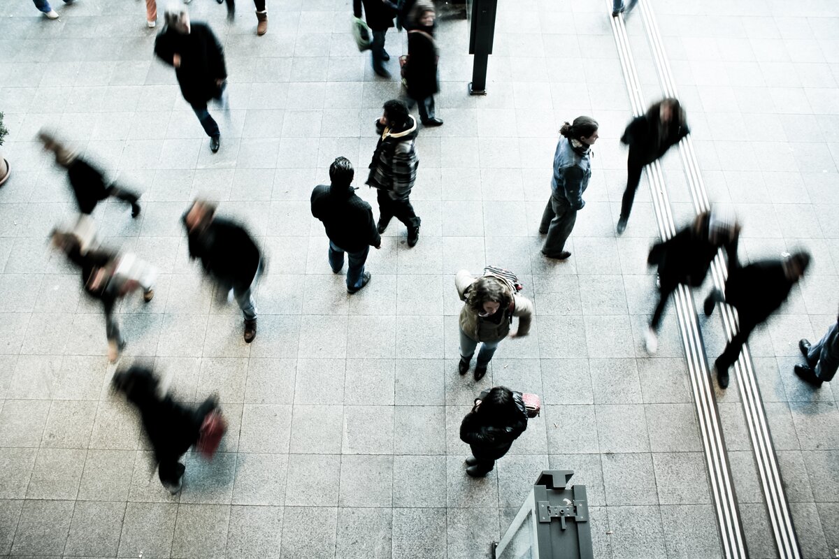 Image shows an arial view of people walking